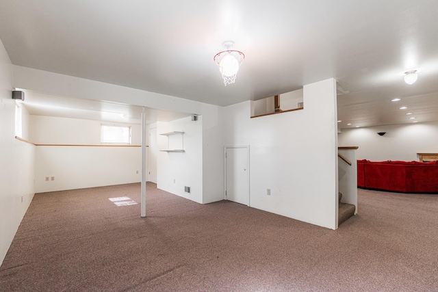 basement featuring recessed lighting, stairs, and carpet floors