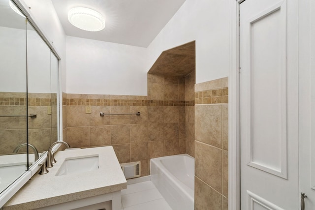 full bathroom with tile patterned flooring, visible vents, a tub, tile walls, and a shower