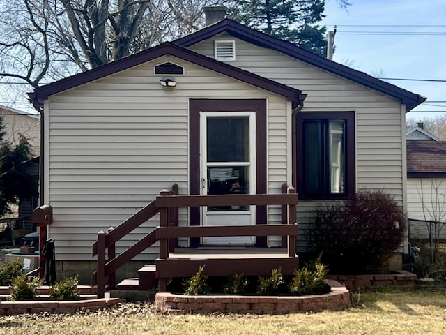 view of front of home featuring a chimney