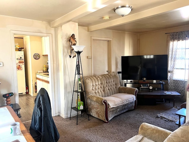 living room with beam ceiling and baseboards