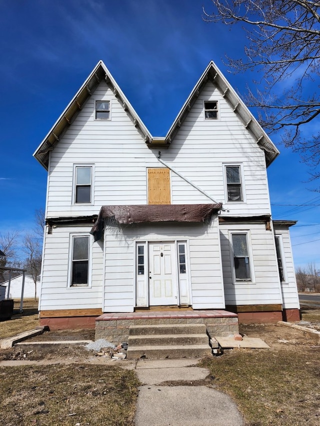 view of front of property with entry steps