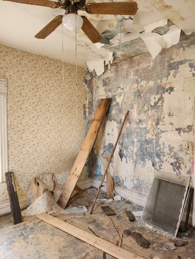 interior space with a ceiling fan