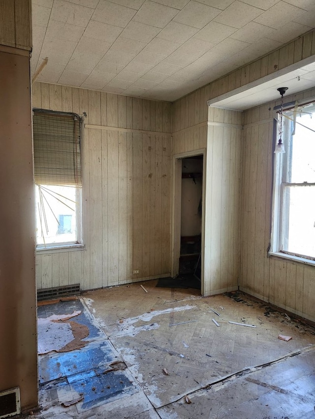 empty room featuring visible vents and plenty of natural light