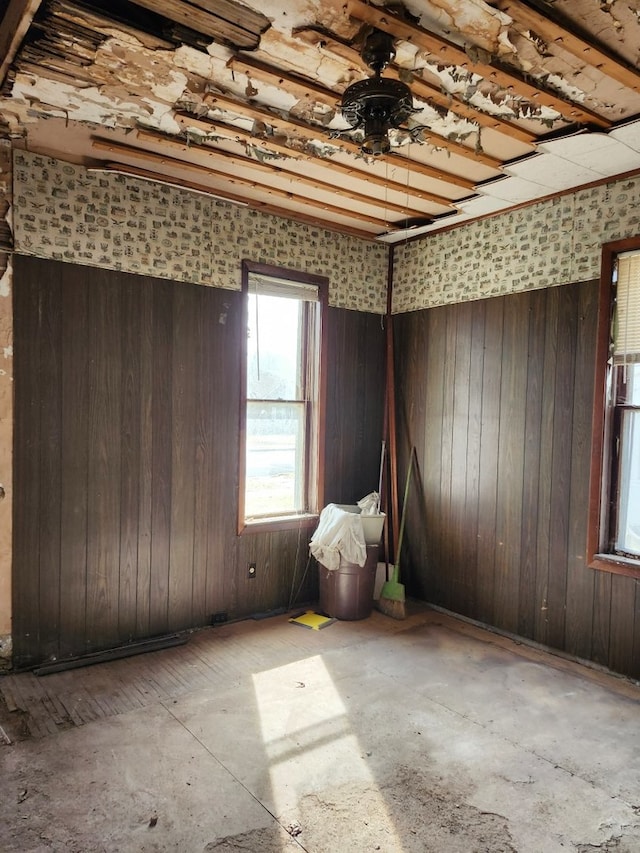 empty room featuring wooden walls