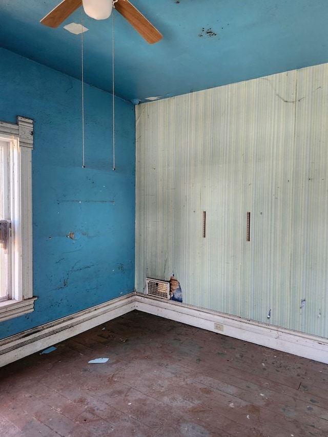 unfurnished room featuring hardwood / wood-style flooring and ceiling fan