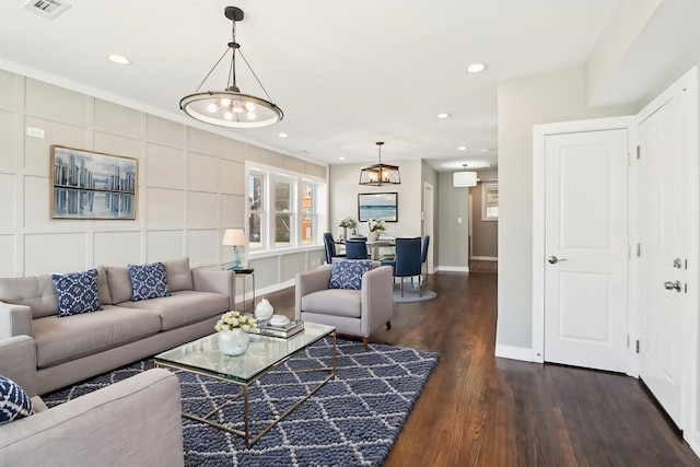 living area with visible vents, recessed lighting, baseboards, and dark wood-style flooring