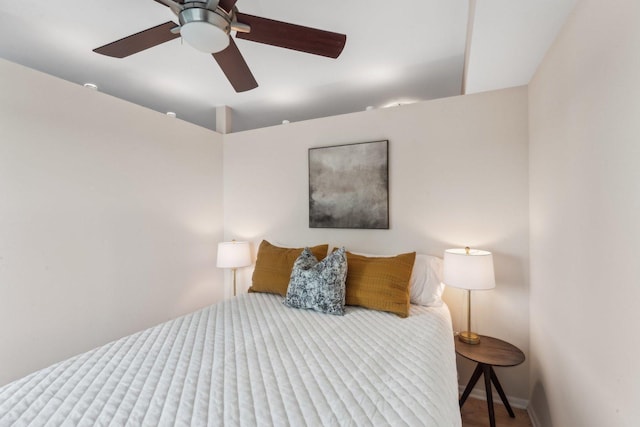 bedroom with baseboards and ceiling fan