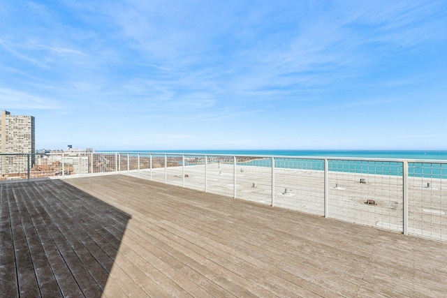 wooden terrace with a water view