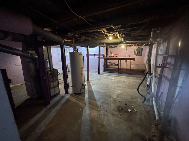 unfinished basement featuring water heater and electric panel