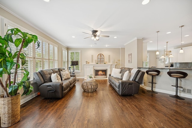living room with dark wood-style flooring, baseboards, a ceiling fan, and recessed lighting