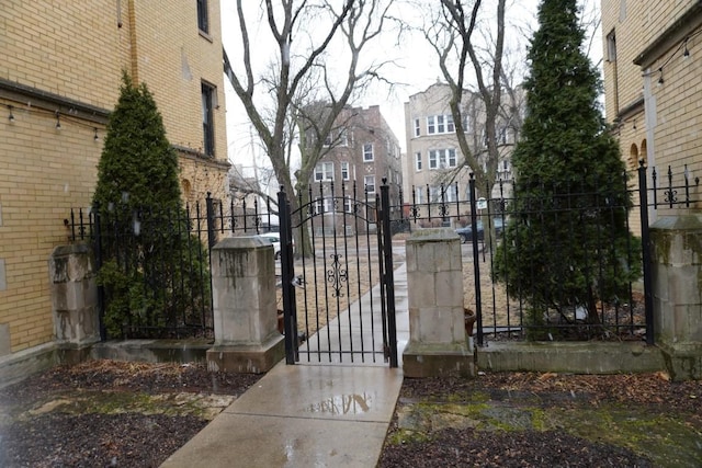 view of gate with fence