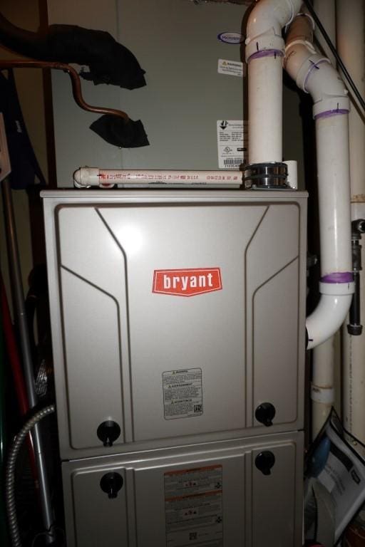 utility room with heating unit