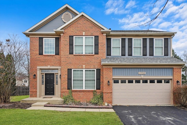 view of front facade with aphalt driveway, brick siding, an attached garage, and a shingled roof