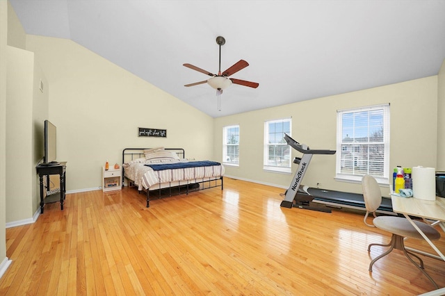 bedroom featuring high vaulted ceiling, baseboards, light wood-type flooring, and ceiling fan