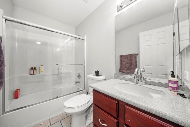 full bathroom featuring enclosed tub / shower combo, toilet, and vanity