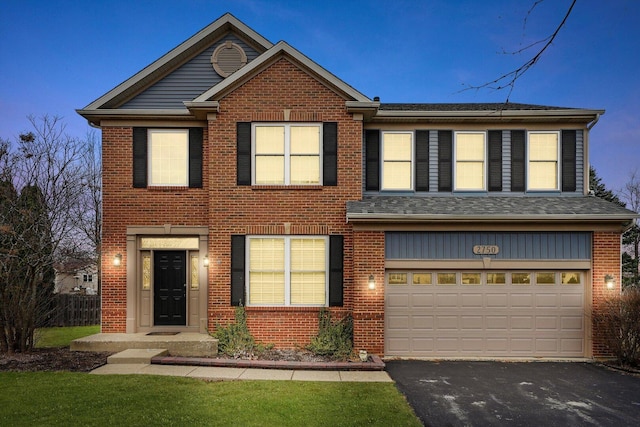 view of front of property featuring brick siding, an attached garage, driveway, and a shingled roof