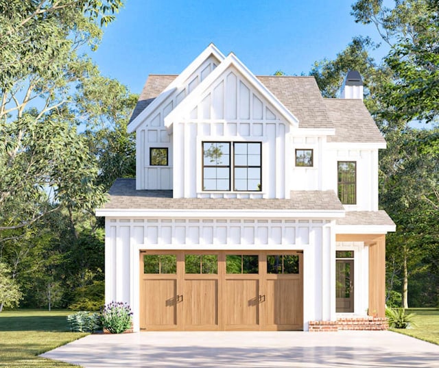 modern inspired farmhouse featuring board and batten siding, concrete driveway, an attached garage, and a front yard