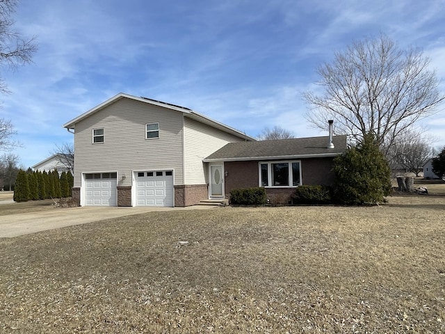 view of front of property with driveway and a garage