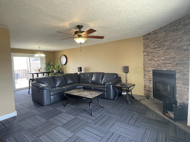 carpeted living room featuring ceiling fan with notable chandelier and a textured ceiling