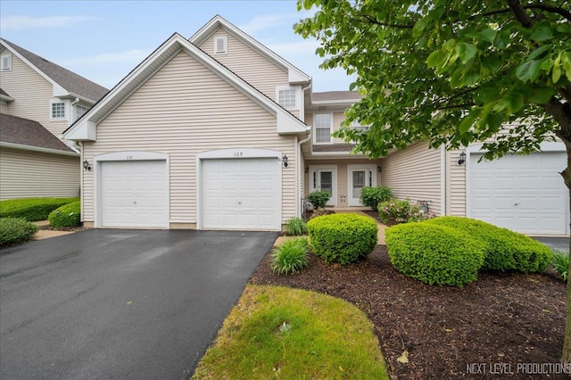 109 Oxford Ct Unit 0, Oswego, IL 60543 - view of front facade featuring asphalt driveway and an attached garage