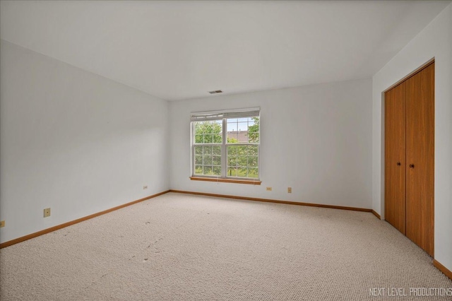 109 Oxford Ct Unit 0, Oswego, IL 60543 - unfurnished room with light colored carpet and baseboards