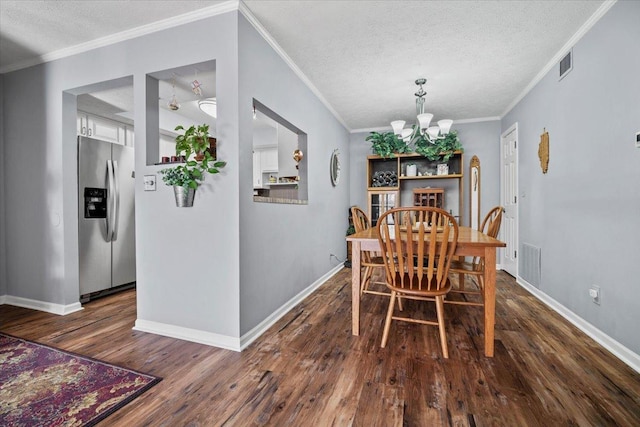 dining area featuring visible vents, a textured ceiling, an inviting chandelier, and dark wood-style flooring