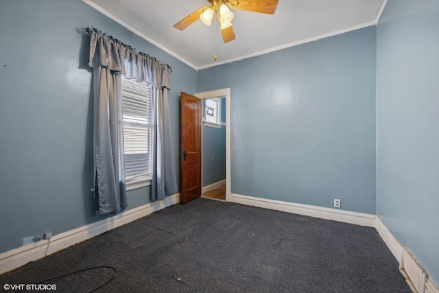 unfurnished room featuring crown molding, carpet, baseboards, and ceiling fan