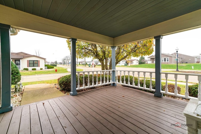 wooden deck with a residential view