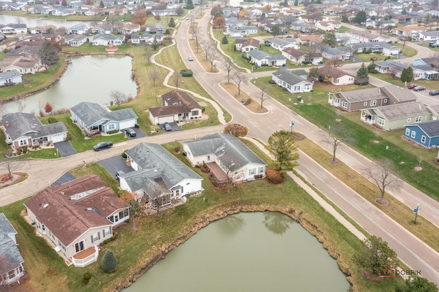 birds eye view of property featuring a residential view and a water view