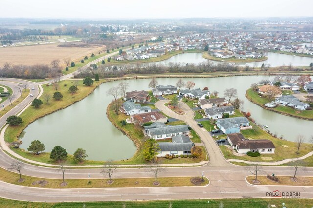 birds eye view of property featuring a water view and a residential view