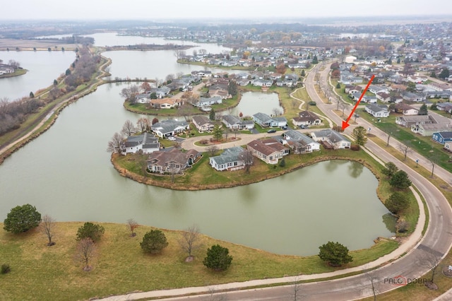 aerial view featuring a residential view and a water view