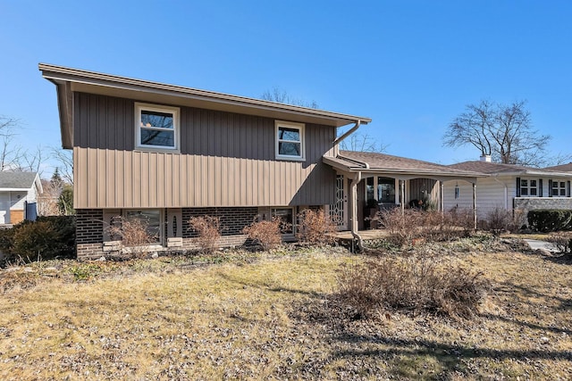 exterior space featuring brick siding