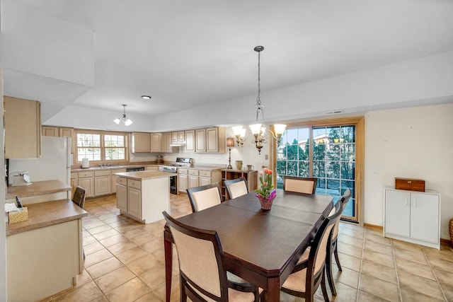 dining room featuring a chandelier and light tile patterned floors