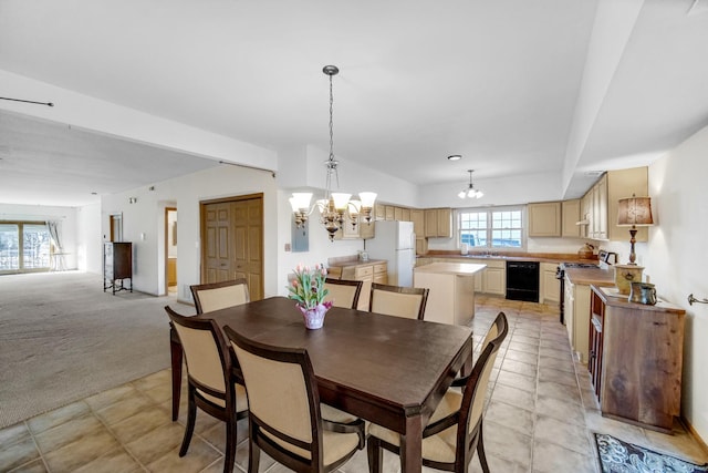 dining room featuring light colored carpet and a notable chandelier