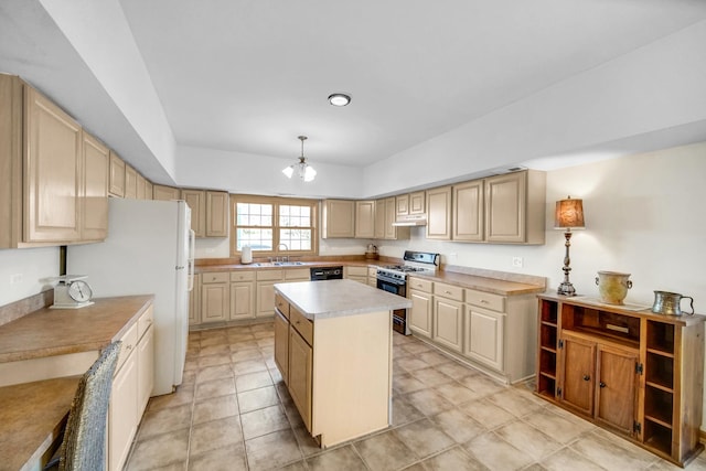 kitchen with a sink, under cabinet range hood, range with gas stovetop, a kitchen island, and light countertops