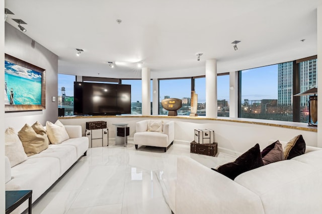 living room featuring baseboards and marble finish floor