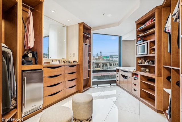 walk in closet featuring light tile patterned floors