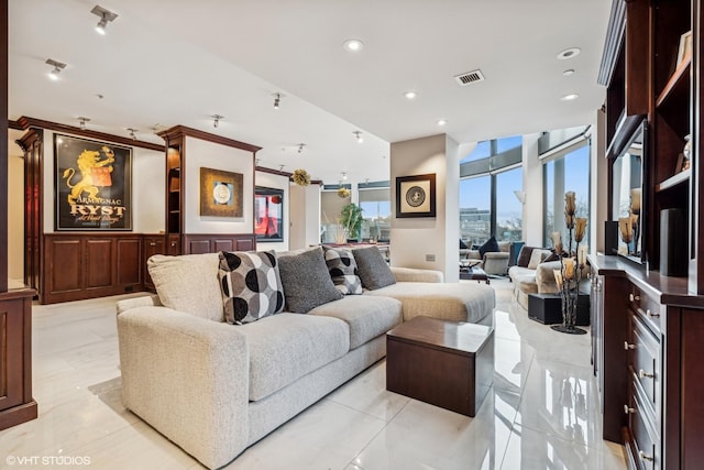 living room featuring recessed lighting and visible vents