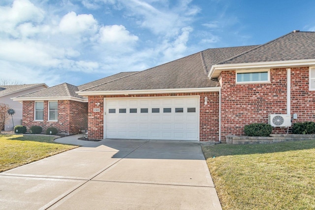 ranch-style house featuring brick siding, an attached garage, a shingled roof, and a front lawn