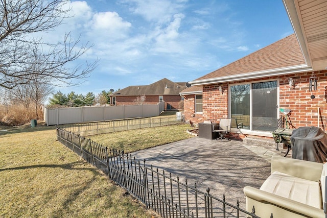 view of patio / terrace with a grill and fence