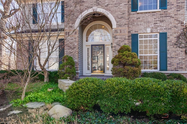 property entrance with brick siding