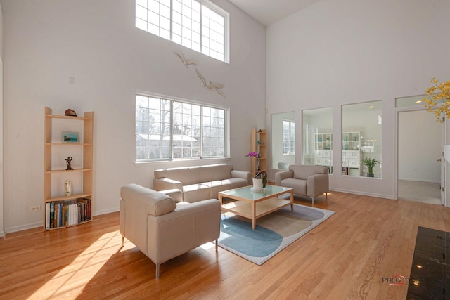 living room featuring wood finished floors and baseboards