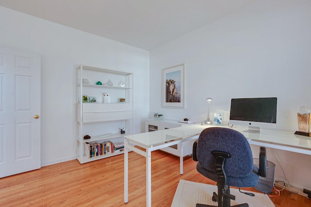 office area with wood finished floors and baseboards