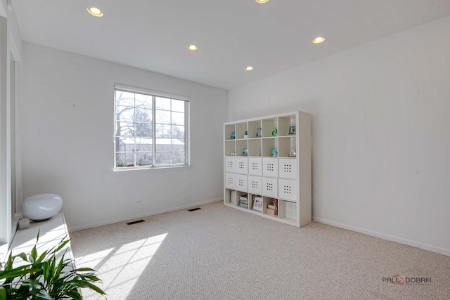 unfurnished bedroom with recessed lighting, visible vents, carpet floors, and baseboards