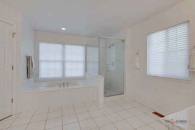 bathroom featuring tile patterned floors, visible vents, a garden tub, and a shower stall