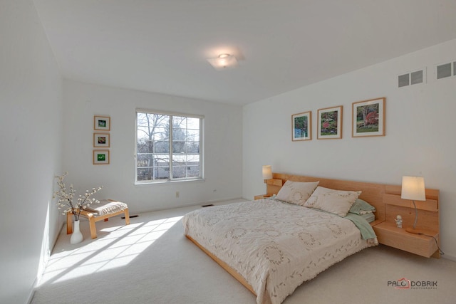 carpeted bedroom with visible vents