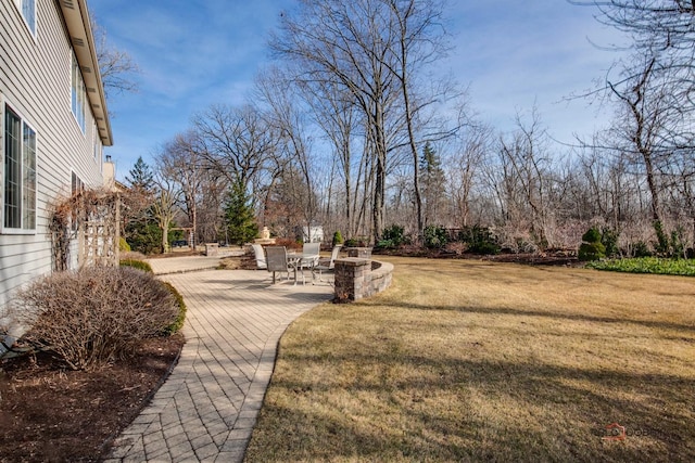 surrounding community featuring a patio and a yard