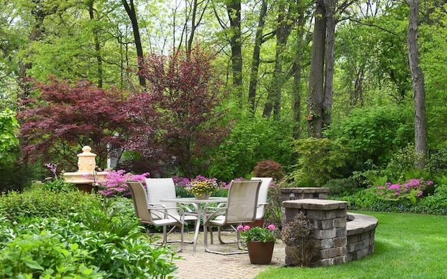 view of patio / terrace featuring a forest view