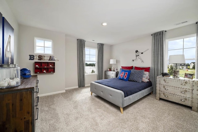 carpeted bedroom featuring visible vents, recessed lighting, and baseboards