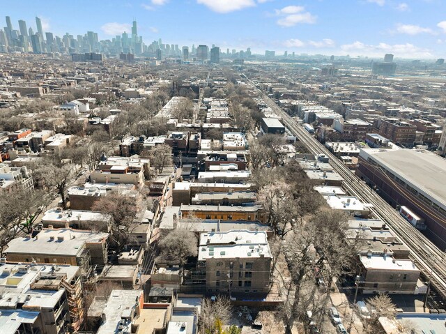 birds eye view of property with a city view